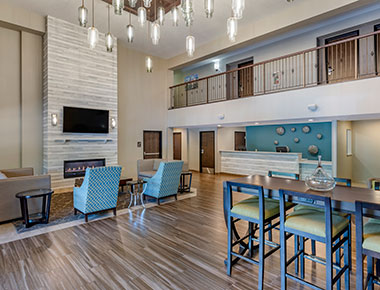 lobby area seating with fire place and front desk